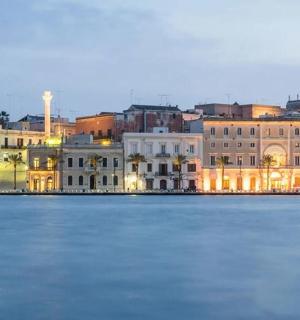 a view of a city from the water at night