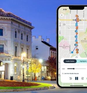 a cell phone with a map on it in front of a building