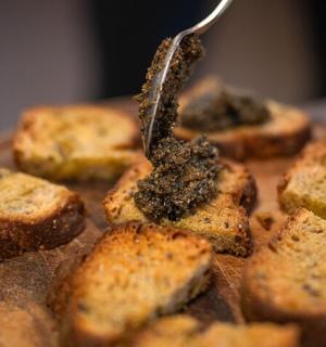 a plate of bread with a fork sticking out