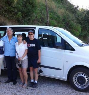 a group of people standing in front of a van