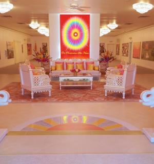 two statues of elephants in a lobby with a couch