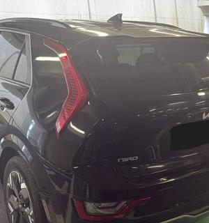 a black car parked in a parking lot