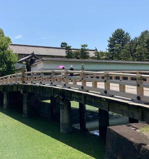 a bridge over a river with people standing on it