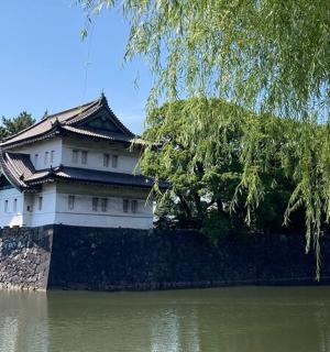 a man and a woman standing in front of a building
