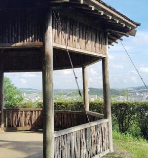 a wooden building with a view of a city