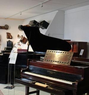 a room with a piano and a room with a room with a room