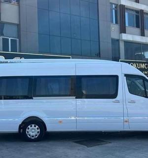 a white van parked in front of a building
