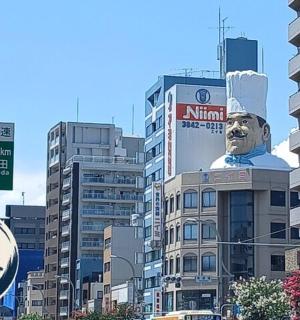 a building with a statue of a chef on top of it