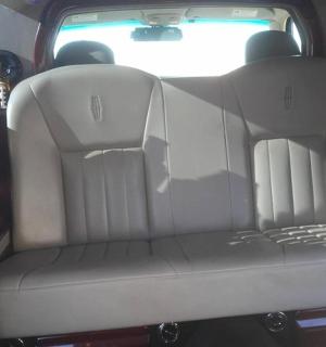 a car seat in the back of a vehicle