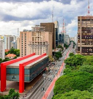 a city with a red building in the middle of a city