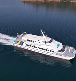a white boat traveling on the water