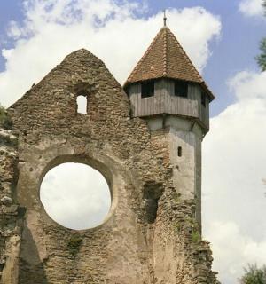 an old building with a window and a tower