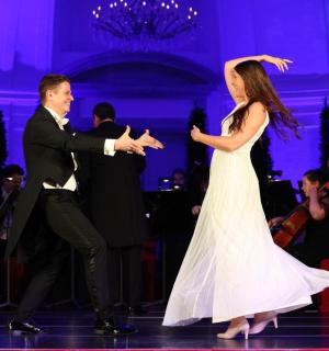 a man and a woman dancing on the dance floor