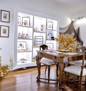 a dining room with a wooden table and chairs