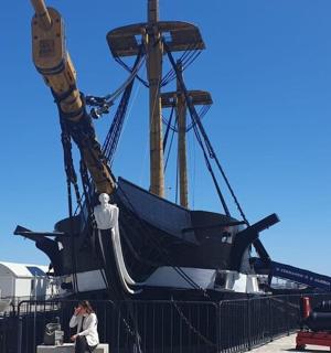 a large boat being lifted onto a dock