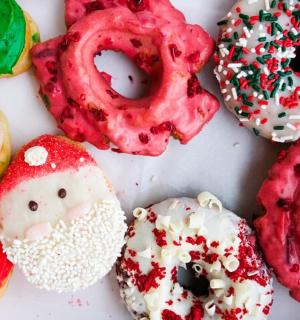 a group of different types of donuts sitting on a table