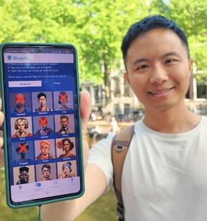 a man is holding up a cell phone