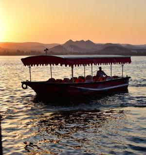 a group of people on a boat on the water