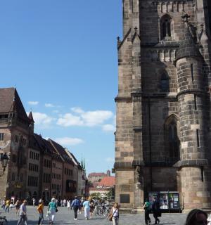 a group of people walking in front of a building