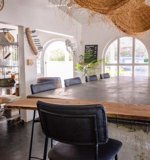 a large dining room with a large table and chairs