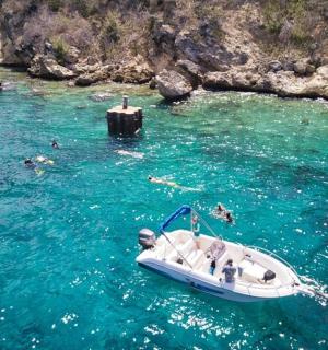 a boat in a body of water with people in it