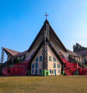 a church with a cross on the front of it