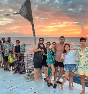 a group of people posing for a picture on a boat