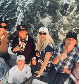 a group of people on a boat in the water