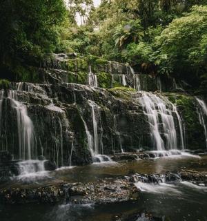 a waterfall in the middle of a river