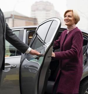 a man and a woman getting out of a car