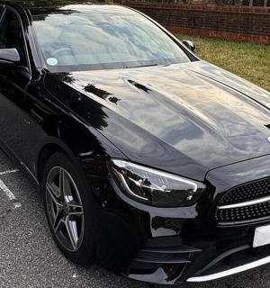a black car parked in a parking lot