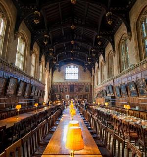 a large room with long tables in a large building