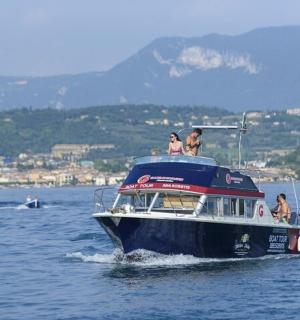 a group of people on a boat in the water