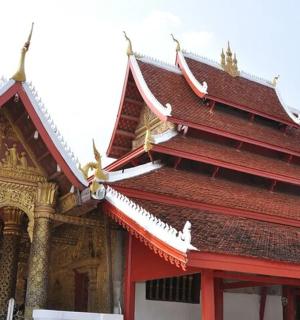 a building with a red and gold roof