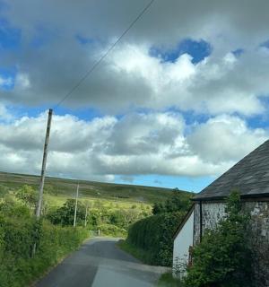 a road with a house on the side of it