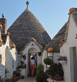 a group of buildings with pumpkins on the roofs