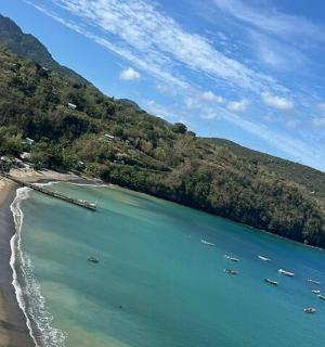 a view of a beach with boats in the water