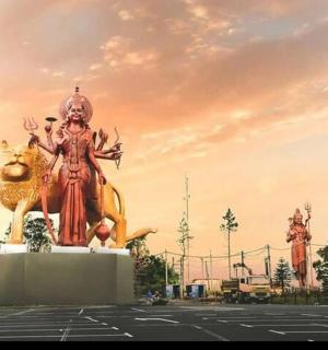 a large statue in a parking lot