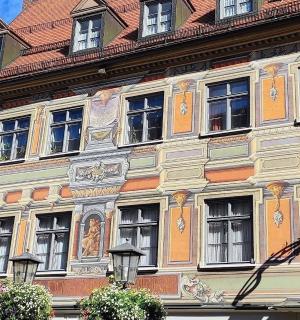 a large building with a statue on the side of it