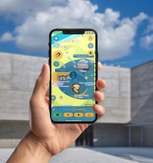 a hand holding a cell phone in front of a building