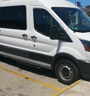 a white van parked in a parking lot