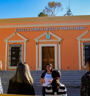 a group of people standing in front of a building