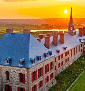 an old building with a tower and a church