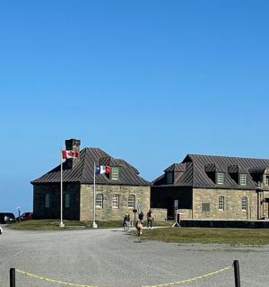a large brick building with a flag on it