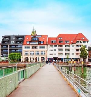 a bridge over a body of water with a building