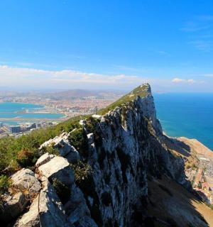 a view of the edge of a mountain overlooking the ocean