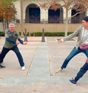 a group of men playing a game with a child