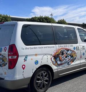 a white van parked in a parking lot
