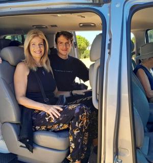 a group of people sitting in the back of a van