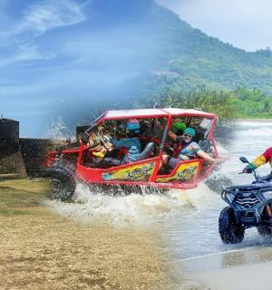 a group of people riding in a four wheeler in the water